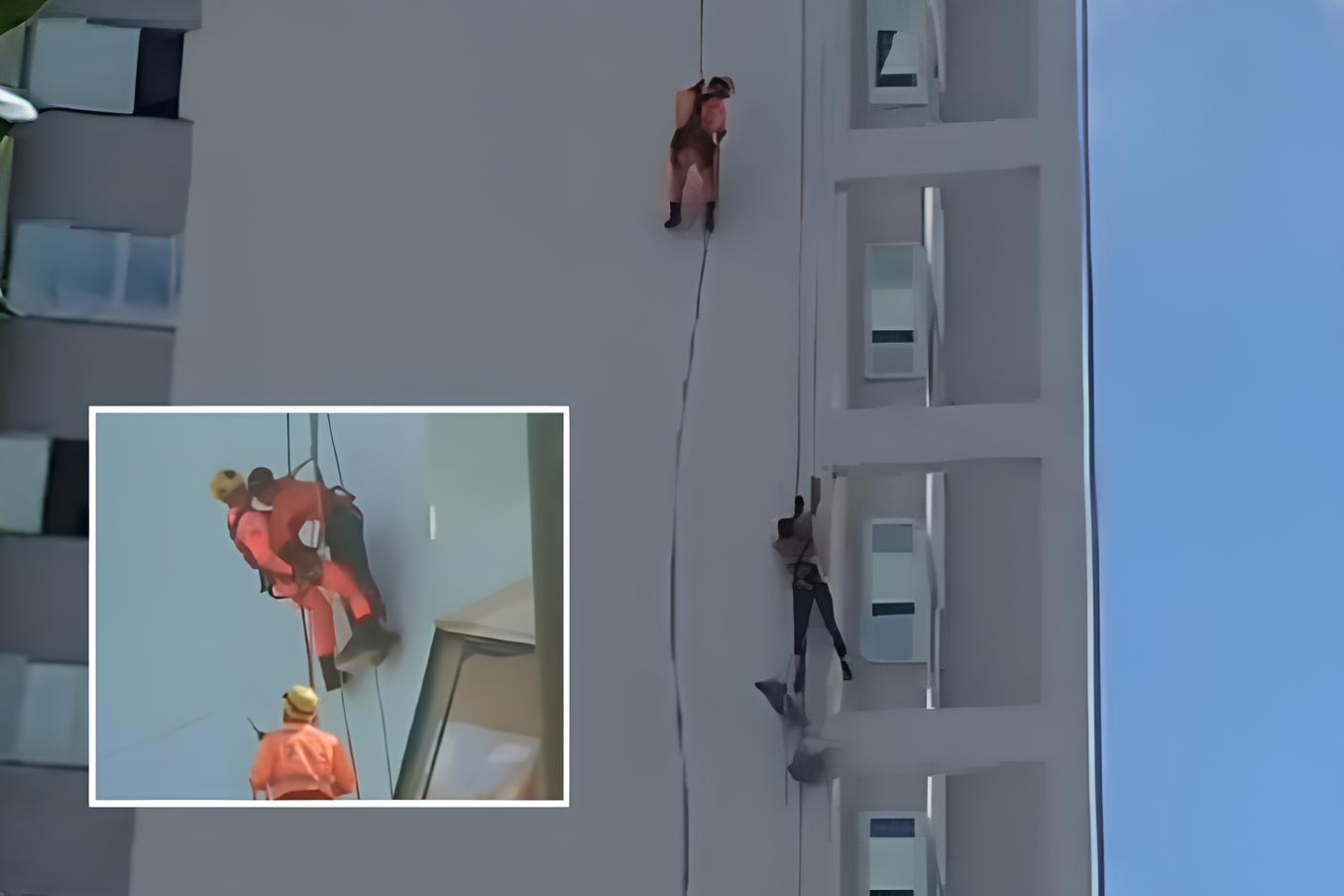 Pintor cai do terraço e fica pendurado na fachada de prédio
